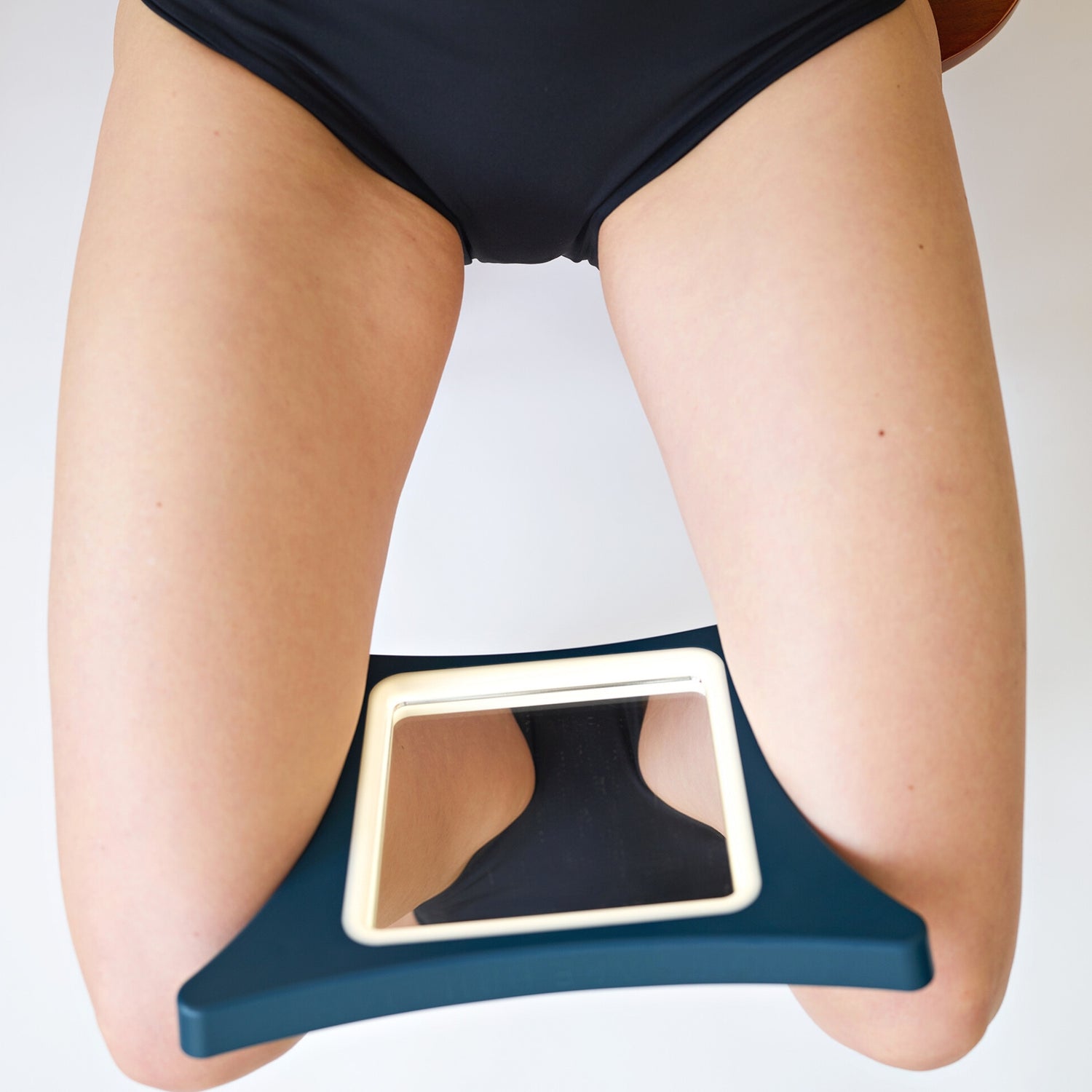 Image of woman using VieVision Between Legs Mirror
